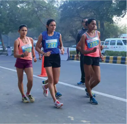  ??  ?? Soumya Baby ( right) en route to her gold in the 20 km event.