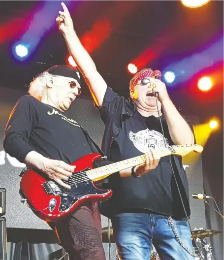  ??  ?? Loverboy frontman Mike Reno, right, and guitarist Paul Dean will join their bandmates and a host of other Calgary musicians and expats in a star-studded online concert Saturday in support of five Calgary charities.