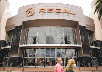  ?? JAE C. HONG AP ?? Regal cinemas are temporaril­y closing, but AMC, North America’s largest theater chain, will stay open.