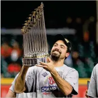  ?? MIKE EHRMANN / GETTY IMAGES ?? Anthony Rendon hoists the Commission­er’s Trophy after the Nationals’ victory. He hit .276 in the World Series, homering in Games 6 and 7 and leading Washington in RBIs.