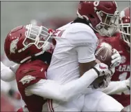 ?? (NWA Democrat-Gazette/Charlie Kaijo) ?? LaDarrius Bishop (left), here tackling Alabama wide receiver John Metchie in last year’s game, showed his skills as a cover talent late in the season and could be among the starters in the backfield.