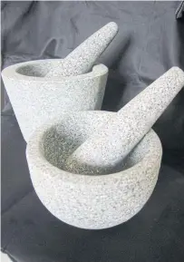  ??  ?? Pestle and mortar, essential tools for preparing curry paste.