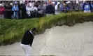  ?? Julio Cortez/AP ?? Jon Rahm comes a-cropper on the 18th, hitting the edge of the bunker when playing out, leading to a double bogey. Photograph: