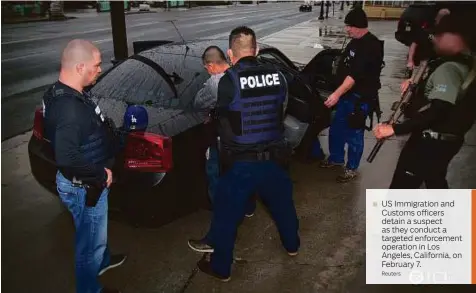  ?? Reuters ?? US Immigratio­n and Customs officers detain a suspect as they conduct a targeted enforcemen­t operation in Los Angeles, California, on February 7.