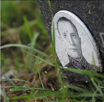  ?? — AP ?? A grave of Red Army soldier at the Soviet Military Cemetery in Warsaw. Even as Poland topples monuments to the Soviet military, it has a policy of not disturbing the graves of Soviet soldiers.