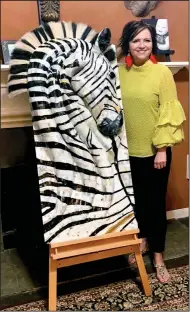  ?? (NWA Democrat-Gazette/Janelle Jessen) ?? Artist Amy Haid poses with a zebra sculpture titled “Mistari Maridadi.”