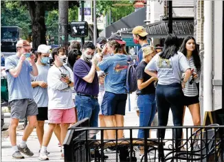  ?? PHOTOS BY HYOSUB SHIN / HYOSUB.SHIN@AJC.COM ?? The University of Georgia reported 1,417 positive cases of COVID-19 between Aug. 31 and Sept. 4, according to an update on its website. The university last week reported 821 positive cases from Aug. 24-28, which had been its highest five-day total since the pandemic began in March.