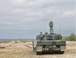  ?? MACIEK NABRDALIK/THE NEW YORK TIMES ?? Ukrainian soldiers operate a Leopard 2 tank last month at a base in Swietoszow, Poland. Analysts say pledges to deliver the vehicles to Ukraine have exposed how unprepared European military forces are.