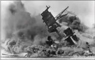  ?? STF—ASSOCIATED PRESS ?? In this Dec. 7, 1941file photo, smoke rises from the battleship USS Arizona as it sinks during the Japanese attack on Pearl Harbor, Hawaii.