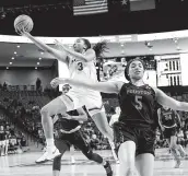  ?? David J. Phillip / Associated Press ?? UConn’s Megan Walker (3) goes up for a shot behind UH’s Dymond Gladney during the first half.