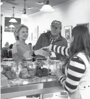  ?? JIM COLE/ASSOCIATED PRESS ?? Hillary Clinton greets a worker at Kristin’s Bakery in Keene, N.H., during her first campaign stop in New Hampshire on April 20, 2015.