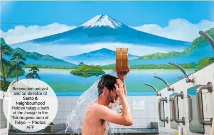  ?? — photos: afp ?? renovation activist and co-director of Sento & neighbourh­ood Holden takes a bath at the Inariyu in the takinogawa area of tokyo.