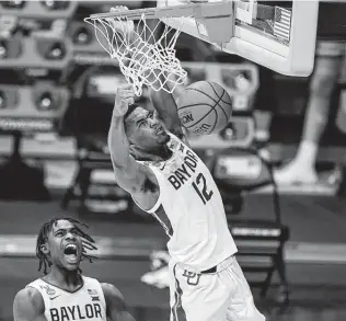  ?? Michael Conroy / Associated Press ?? Baylor's Davion Mitchell, left, and Jared Butler started their careers at Southeaste­rn Conference schools before transferri­ng to Waco and becoming part of college basketball's best backcourt.