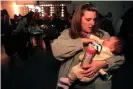  ?? Peterson/Corbis/Getty Images ?? Vycki Higley, with daughter Robyn, who was born seven weeks after her father died in the World Trade Center. Photograph: Mark