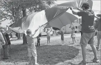  ?? LAWRENCE POWELL ?? There was plenty for kids to do at Canada Day celebratio­ns in Middleton at Macdonald Museum. The parachute was popular as Town of Middleton recreation staff spent time with the youngsters.