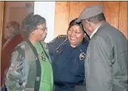  ?? Diane Wagner / RN-T ?? Laney Stevenson (from left) and Rome Police Chief Denise Downer-McKinney share a laugh with John Stevenson, one of the honorees during the City Commission’s Black History Month program at Rome City Hall.
