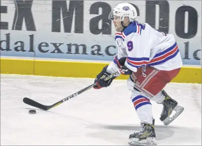  ?? JASON SIMMONDS/JOURNAL PIONEER ?? Summerside D. Alex MacDonald Ford Western Capitals forward Alex Hambly of Stratford carries the puck during Saturday’s 6-0 victory over the Woodstock Slammers at Eastlink Arena.