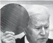  ?? AP-Yonhap ?? U.S. President Joe Biden holds up a silicon wafer during the CEO Summit on Semiconduc­tor and Supply Chain Resilience in the Roosevelt Room of the White House, in Washington, D.C., Monday.