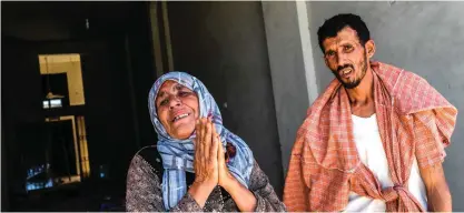  ??  ?? RAQQA: Members of the Sheikh Wais family react as they ask Kurdish fighters to recover the bodies of her relatives from under the rubble on July 12, 2017 during an offensive. — AFP