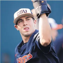  ?? NATI HARNIK/ASSOCIATED PRESS ?? Oregon State’s Luke Heimlich works with weights Friday during a practice at TD Ameritrade Park in Omaha, Neb., in preparatio­n for today’s College World Series game against North Carolina.