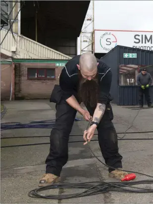  ??  ?? Technician­s pack up TV cables at Fir Park after the pandemic hit the UK earlier this month