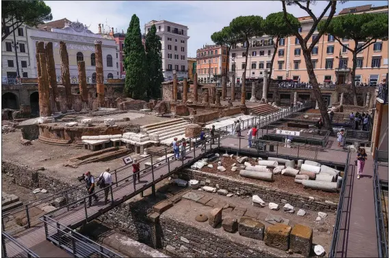 ?? ?? For decades, people had to gaze down from the bustling sidewalks rimming Largo Argentina (Argentina Square) to admire the temples below where Julius Caesar mastermind­ed his political strategies and was later fatally stabbed in 44 B.C.