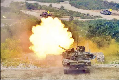  ?? AFP ?? A South Korean K2 tank conducts a live fire demonstrat­ion in Pocheon, Seoul yesterday.