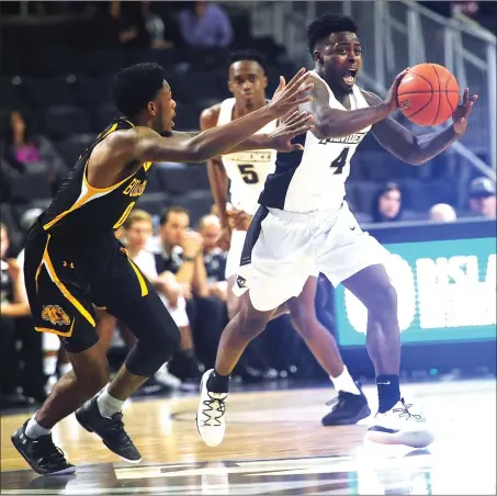  ?? File photo by Ernest A. Brown ?? Maliek White (4) and Providence look for their third victory against a New England opponent in the last seven days when UMass comes to the Dunkin’ Donuts Center tonight at 7. The Friars defeated URI Saturday at home before downing Boston College Tuesday night in overtime.