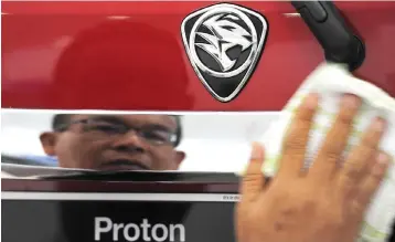  ??  ?? Should the deal go through, a second provisiona­l agreement between DRB-Hicom and Geely for the sales of a 51 per cent stake in Lotus – a UK racing car manufactur­er owned by Proton – will take place for a total cash considerat­ion of RM284 million.