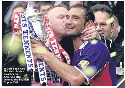  ??  ?? ■ Gers boss Alex McLeish plants a smacker on Amoruso after winning the Scottish Cup in 2002.