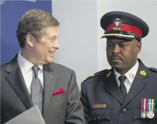  ?? Tyler Anderson / National Post files ?? Mayor John Tory and Toronto police Chief Mark Saunders had been in close associatio­n on the controvers­ial topic of carding.