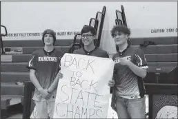  ?? Photo by Rebekah Albertson ?? BACK TO BACK VICTORIES— Nanook Esports team Calvin Fry, Parker Kenick and Bode Leeper celebrate their second state eSports title in a row.