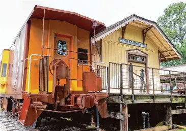  ?? Photos by Kirk Sides/Staff photograph­er ?? A Southern Pacific caboose stands next to the historic Magnolia Depot Museum, which reopened on April 6 after a four-year closure during the COVID-19 pandemic. It’s now open from 10 a.m. to 5 p.m. on Saturdays.