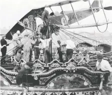  ??  ?? In a scary highlight of the 1919 Calgary Stampede, a Curtiss Jenny crashlande­d on top of the carousel. First World War flying ace Freddie Mccall was giving a ride to the two young sons of Exhibition manager E. L. Richardson when the plane lost power. No one was injured.