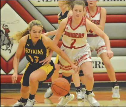  ?? Staff photo/Jake Dowling ?? New Knoxville’s Haley Fledderjoh­ann (2) and Botkins’ Carmen Hueker (13) chase a loose ball in the first half of a non-conference girls basketball game on Saturday.