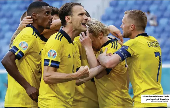  ?? Anatoly Maltsev/Pool/AP ?? Sweden celebrate their goal against Slovakia