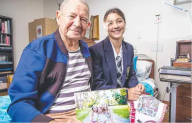  ??  ?? Charlotte Flynn-Grant, 15, with Bernhard Kreyzig, 93, at Clanwillia­m Aged Care. Picture: Nigel Hallett