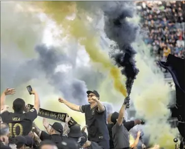  ?? Genaro Molina Los Angeles Times ?? FANS CELEBRATE LAFC’s win in the first game at Banc of California stadium in 2018. LAFC acknowledg­ed it missed the backing of its crowds last season but said it can’t blame its 2020 lapses entirely on empty stands.