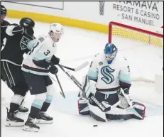  ?? Associated Press ?? Seattle Kraken goaltender Joey Daccord (35) stops a shot during the second period against the Los Angeles Kings on Wednesday in Los Angeles. The Kraken won 2-1.