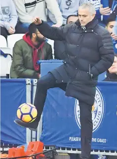  ??  ?? Manchester United’s Portuguese manager Jose Mourinho controls the ball during the English Premier League football match between Leicester City and Manchester United at King Power Stadium in Leicester, central England.