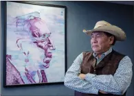  ?? CP PHOTO JEFF MCINTOSH ?? Tsuut’ina Chief Lee Crowchild stands in front of a painting of a Tsuut’ina elder at his office in Calgary. Bulldozers and excavators are cutting a broad swath through the reserve land of the Tsuut’ina in southwest Calgary as part of a transforma­tive...