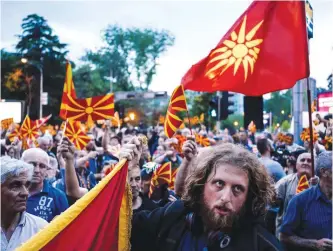  ?? AFP ?? SKOPJE: Protesters demonstrat­e in front of the local EU building in Skopje, days after nationalis­t protesters stormed the building in anger over a vote for a new speaker.—