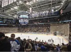  ?? RICK MADONIK/TORONTO STAR FILE PHOTO ?? At Leaf games, paper 50/50 tickets placed in a drum have been replaced by electronic kiosks and handheld devices, allowing for longer selling.