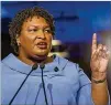  ?? ALYSSA POINTER / ALYSSA.POINTER@AJC.COM ?? Democrat Stacey Abrams hopes provisiona­l ballots and other not-yet-recorded votes could force a runoff.