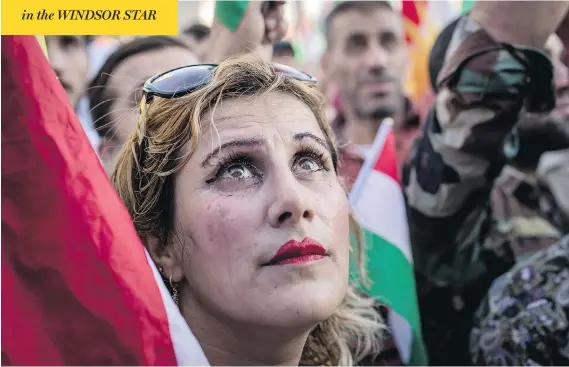  ?? CHRIS MCGRATH / GETTY IMAGES ?? Demonstrat­ors outside the U.S. embassy in Irbil, Iraq, protested Saturday against the escalating crisis with Baghdad and called on the internatio­nal community for assistance.