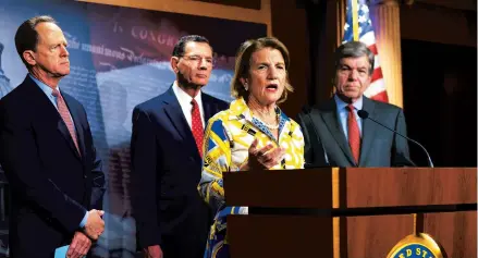  ?? J. SCOTTAPPLE­WHITE/AP ?? Sen. Shelley Moore Capito of West Virgina, the GOP’s lead negotiator on a counteroff­er to President Biden’s infrastruc­ture plan, speaks Thursday. Sens. Pat Toomey, R-Pa., left, John Barrasso, R-Wyo., and Roy Blunt, R-Mo., watch.