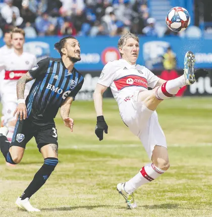  ?? GRaHAM HUGHES/ THE CANADIAN PRESS ?? The Impact’s Maximilian­o Urruti, left, closes in on Chicago Fire star Bastian Schweinste­iger during second-half action on Sunday at Saputo Stadium. The Impact have won back-to-back outings for the first time this season after dousing the Fire 1-0.