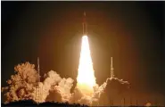  ?? JOHN RAOUX — THE ASSOCIATED PRESS ?? NASA’s new moon rocket lifts off from Launch Pad 39B at the Kennedy Space Center in Cape Canaveral, Fla., on Wednesday. This launch is the first flight test of the Artemis program.