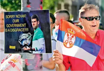  ?? — AP ?? Supporters of Serbia’s Novak Djokovic wait outside the Park Hotel, used as an immigratio­n detention hotel where Djokovic is confined in Melbourne, Australia, on Sunday.