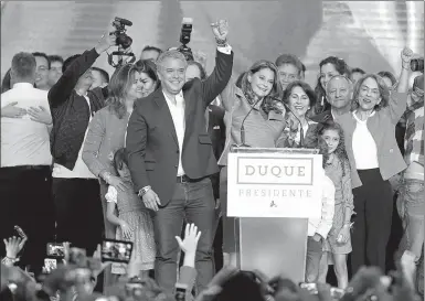  ?? ANDRES STAPFF / REUTERS ?? Presidenti­al candidate Ivan Duque and Marta Lucia Ramirez, his candidate for vice-president, celebrate after he won the presidenti­al election in Bogota, Colombia, on Sunday.